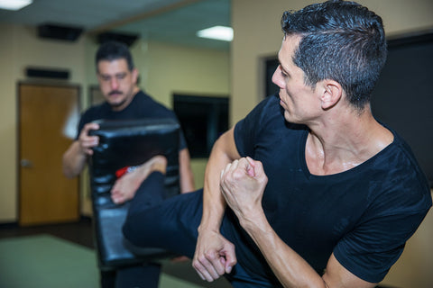 A photo of Steven Lopez demonstrating part of his superhuman kicking system in Taekwondo for Combat Sports.