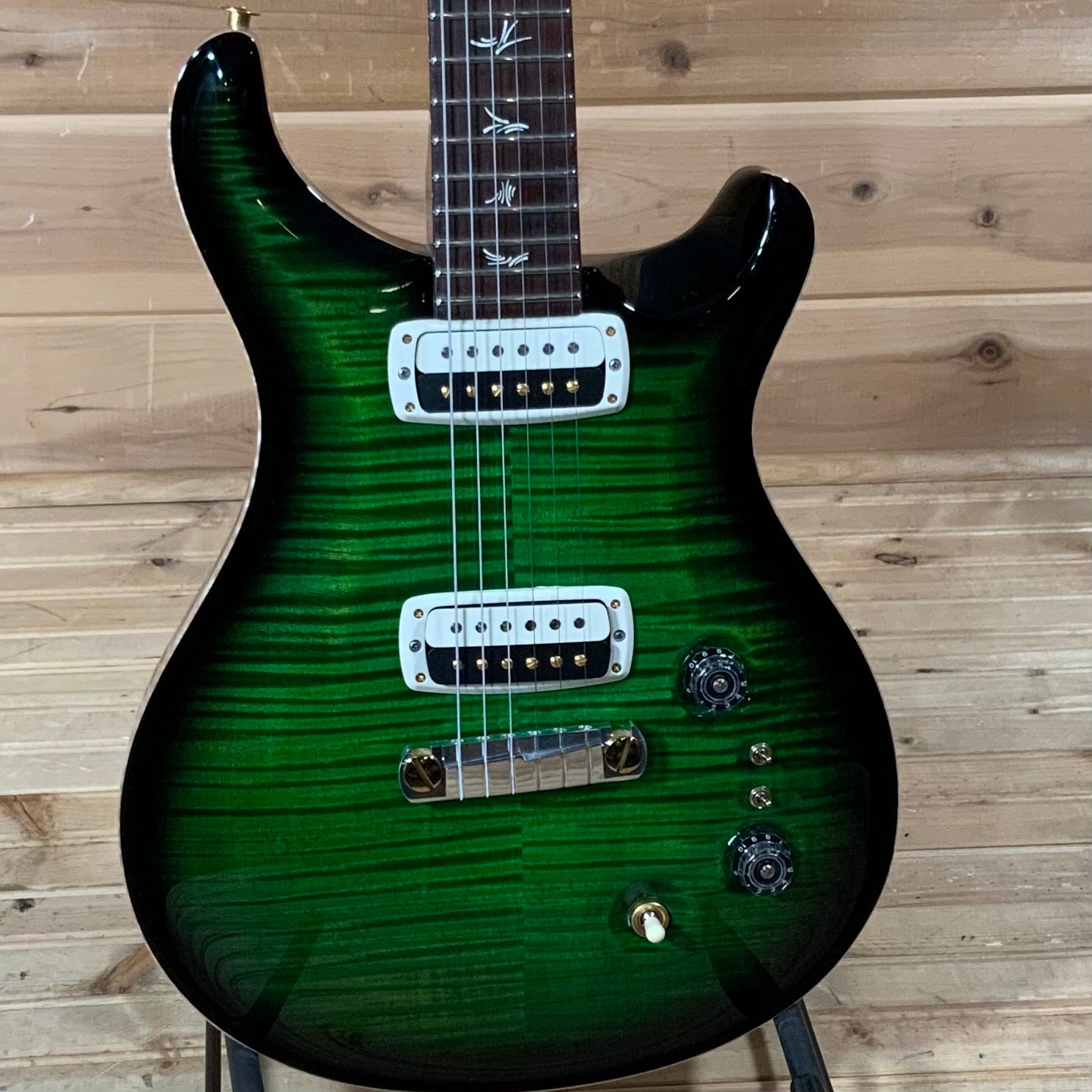 dark green electric guitar