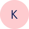 A pink circle with the letter 'K' in dark blue.