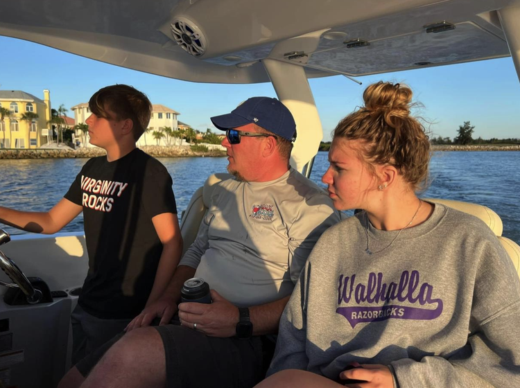 The 3-person bridge seating is one of the features of the SAV. Here we see son Nicholas, 14, at the helm, a proud Dad, and 16-year-old Megan, who loves boating with her friends.