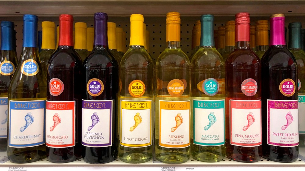 A variety of Barefoot wines including Barefoot Pink Moscato are visible on a shelf.