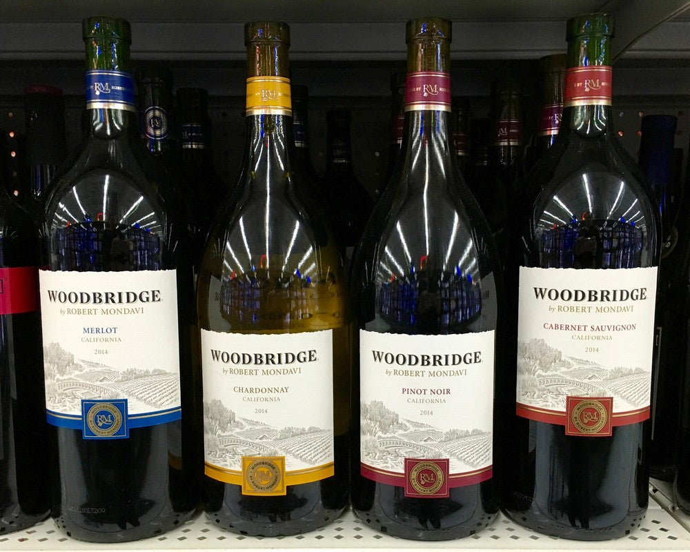 A small selection of Woodbridge by Robert Mondavi wines, including Woodbridge by Robert Mondavi Chardonnay, are visible on the shelf 