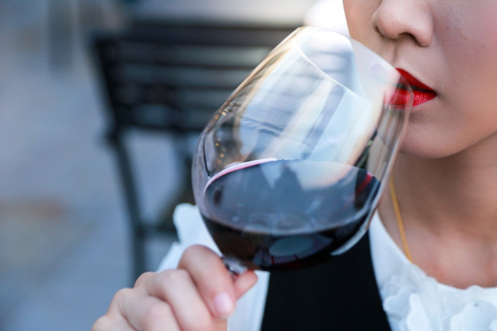 woman drinking red wine