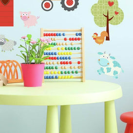 A colorful kids room with wall decals and toys