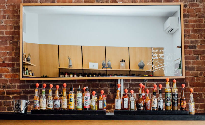 A lineup of Heatonist hot sauces.