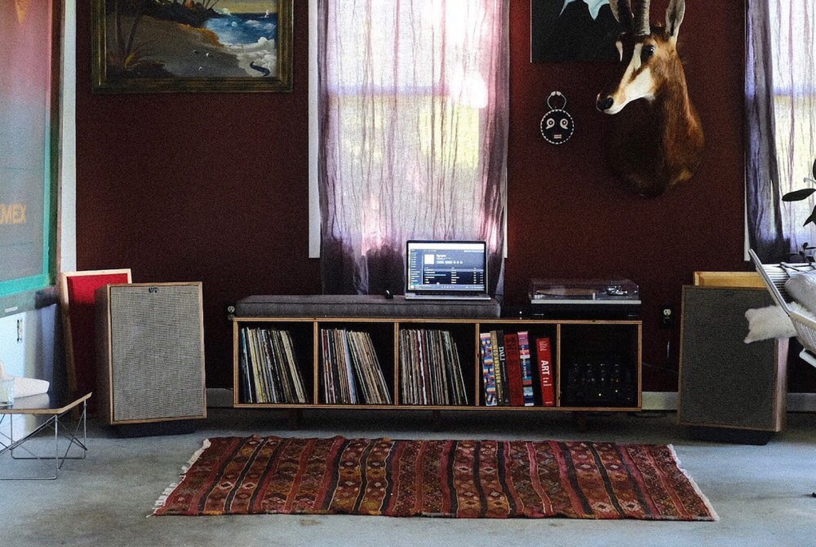Room with large audio set up (Records, record player, and speakers)