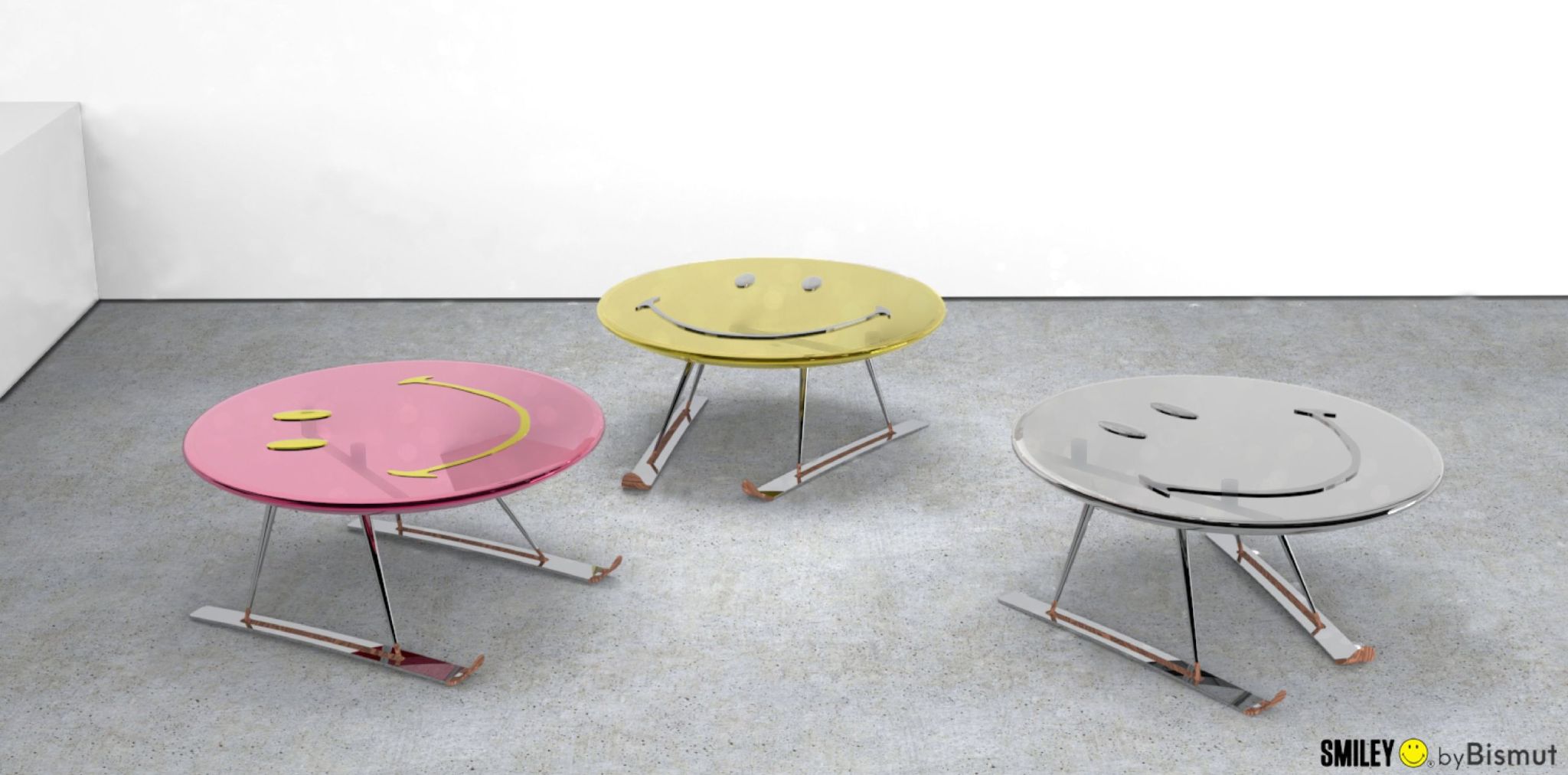 Coffee table models from the Bismut & Bismut x Smiley collaboration. Each table has a Smiley face top balanced on a pair of skis set in parallel or angled in snowplow position and is fashioned from polished stainless steel, with a top available in three colours. The mouth and eyes are made of artisanal glass, while the upturned ski tips are in chestnut. 