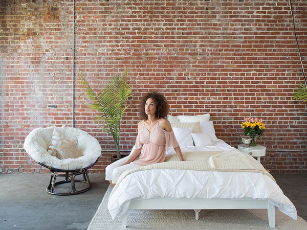 Benefits of Sleep: Refreshed Woman on Comfortable New Bed