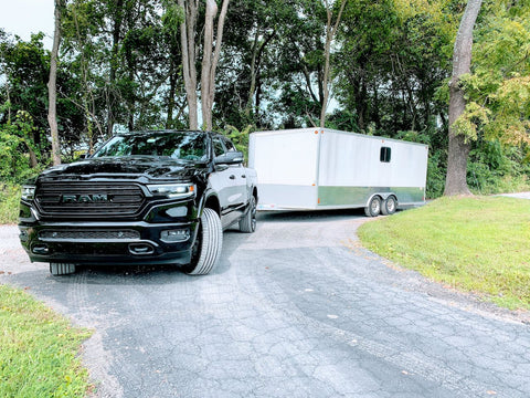 black truck towing trailer