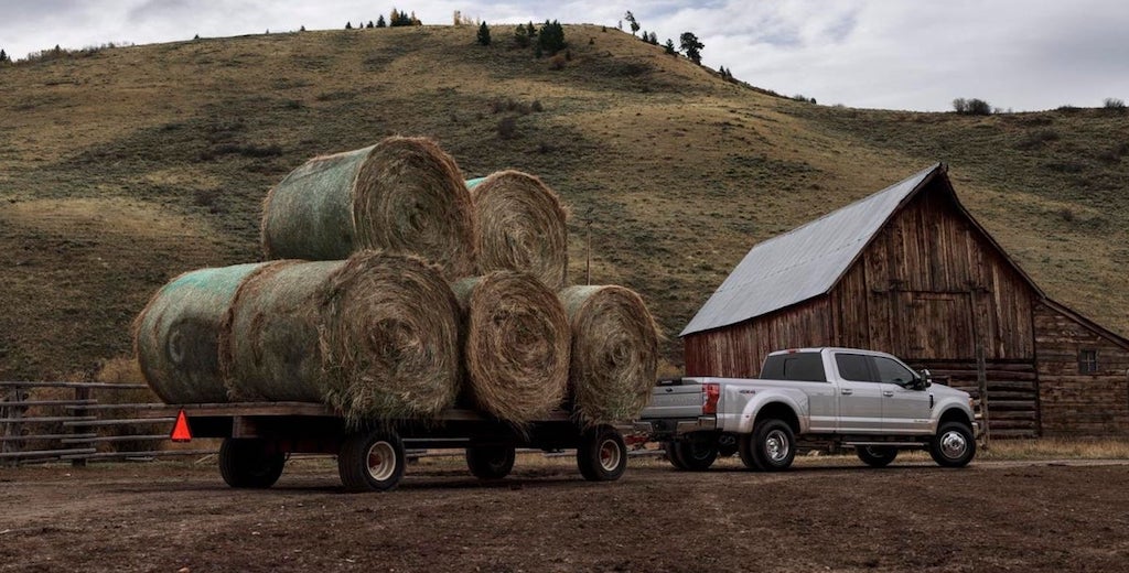 Pickup with upgraded suspension hauling hay