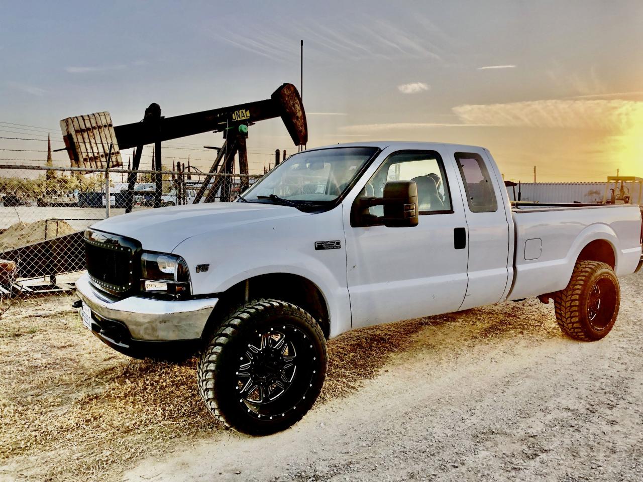 White 2021 Ford F150 with Rubber Helper Springs by Timbren