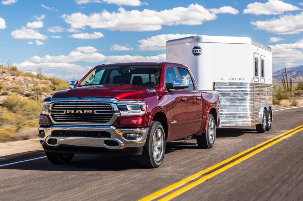 red truck towing trailer