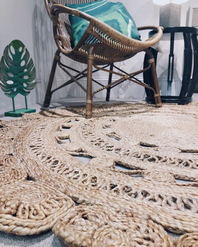 a heavily textured rug paired with a bohemian style chair