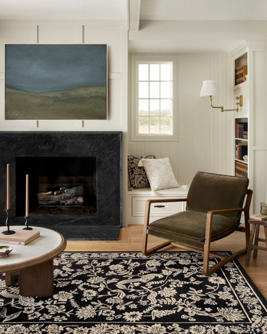 black and white rug with intricate design in a living room