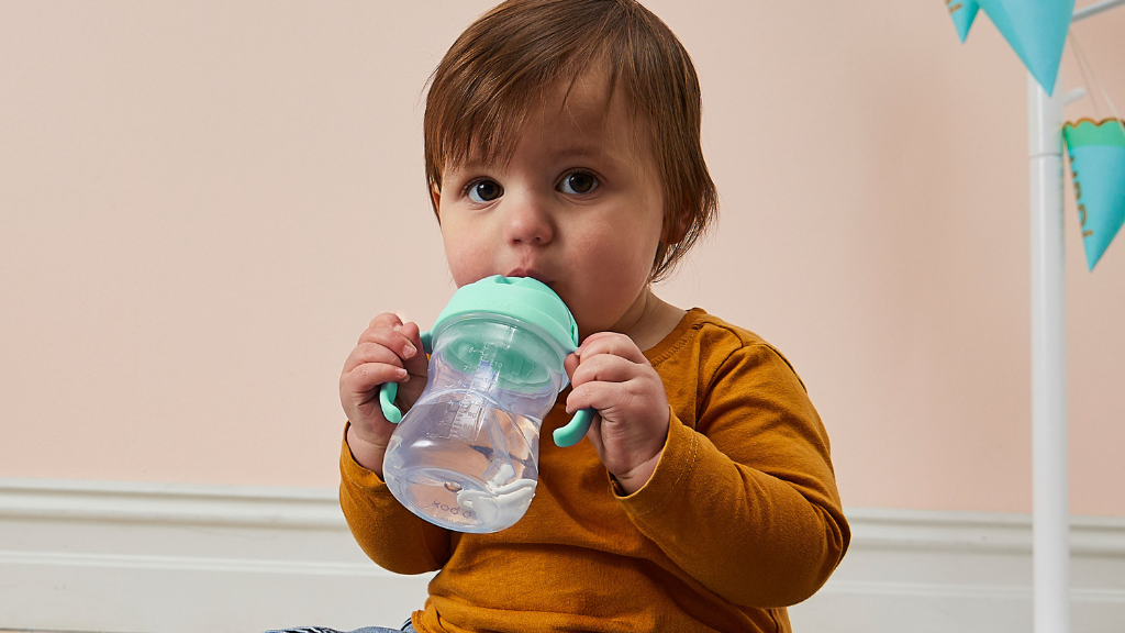 child using b.box sippy cup for drinking