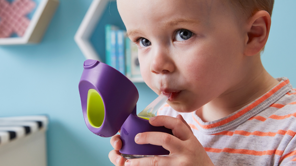 child using b.box tritan water bottle for drinking