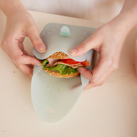 a b.box silicone lunch pocket containing a sandwich