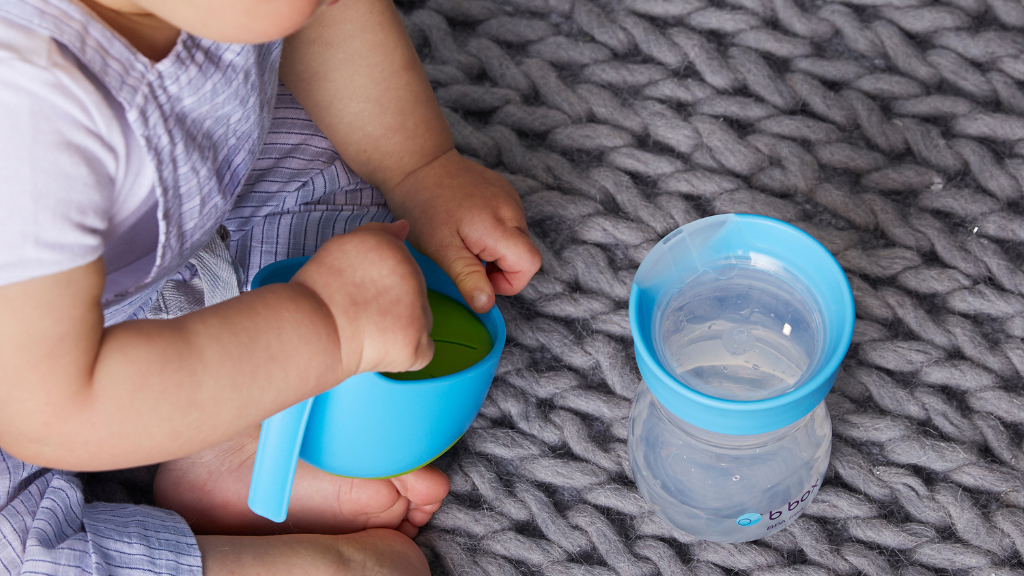 child using b.box training cup for drinking