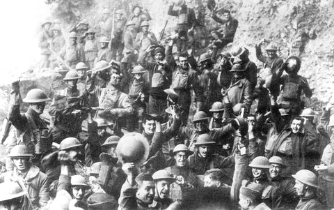 Doughboys of the 64th Regiment, 14th Brigade, 7th Division, celebrate the news of the Armistice with Germany, November 11, 1918.