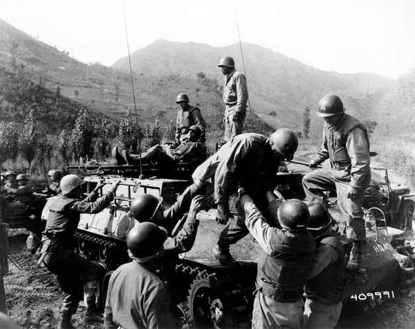 Corpsmen assist wounded from the 31st Regiment during the Battle of Triangle Hill.