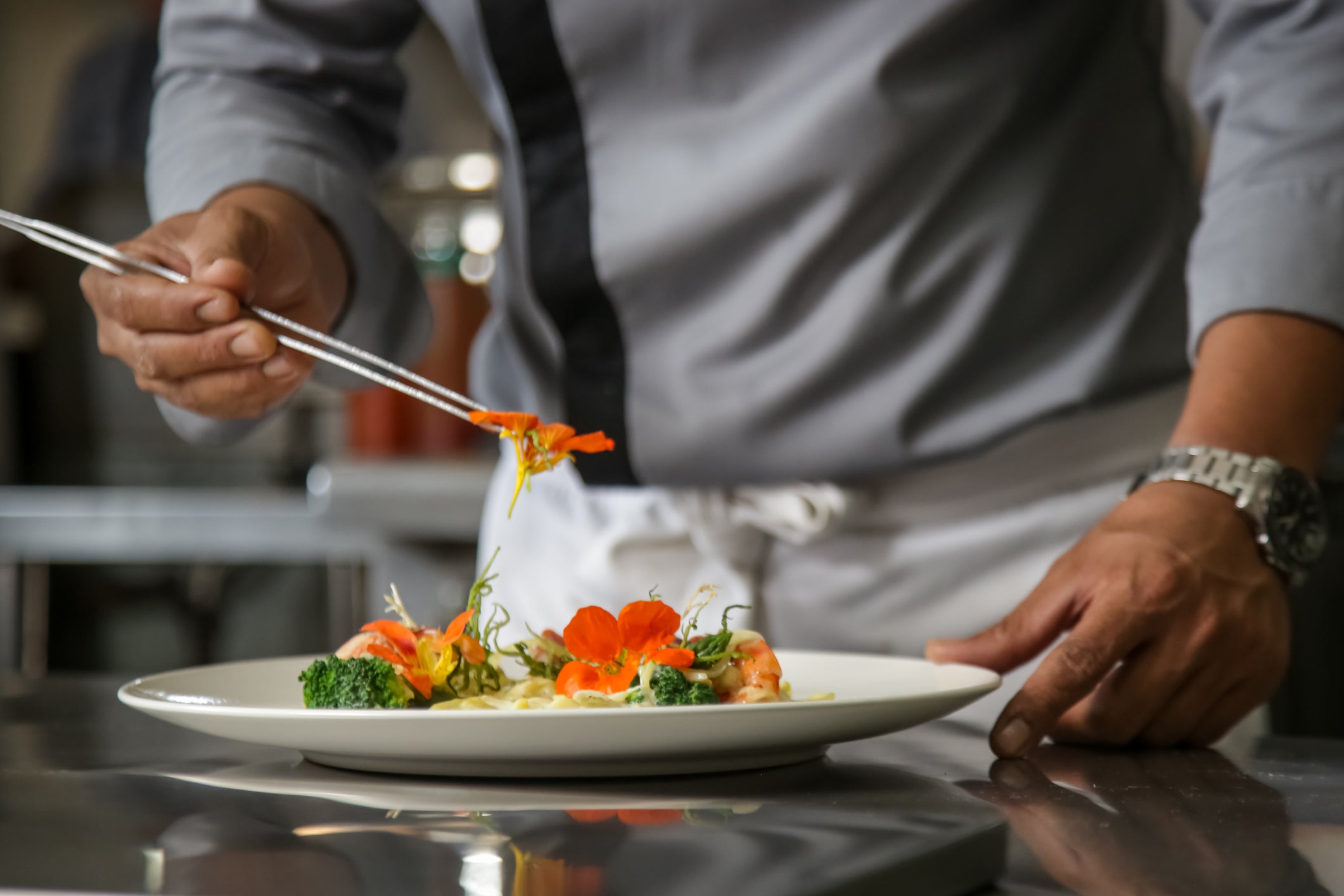 Chef arranging decoration on plate