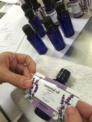 Lila labeling lavender essential oil she distilled.