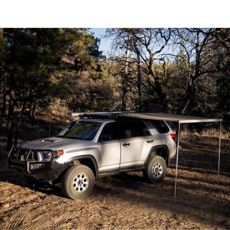 eezi-awn-lite-awning-beige-open-side-view-on-toyota-4runner-in-nature