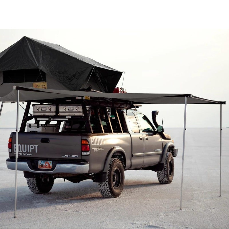 eezi-awn-manta-270-awning-gray-open-rear-back-view-on-toyota-tundra-with-rooftop-tent-in-nature