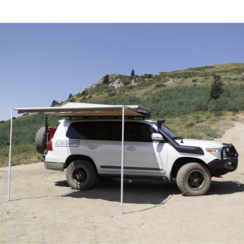 eezi-awn-series-2000-awning-close-side-view-black-hard-case-on-land-cruiser-in-nature