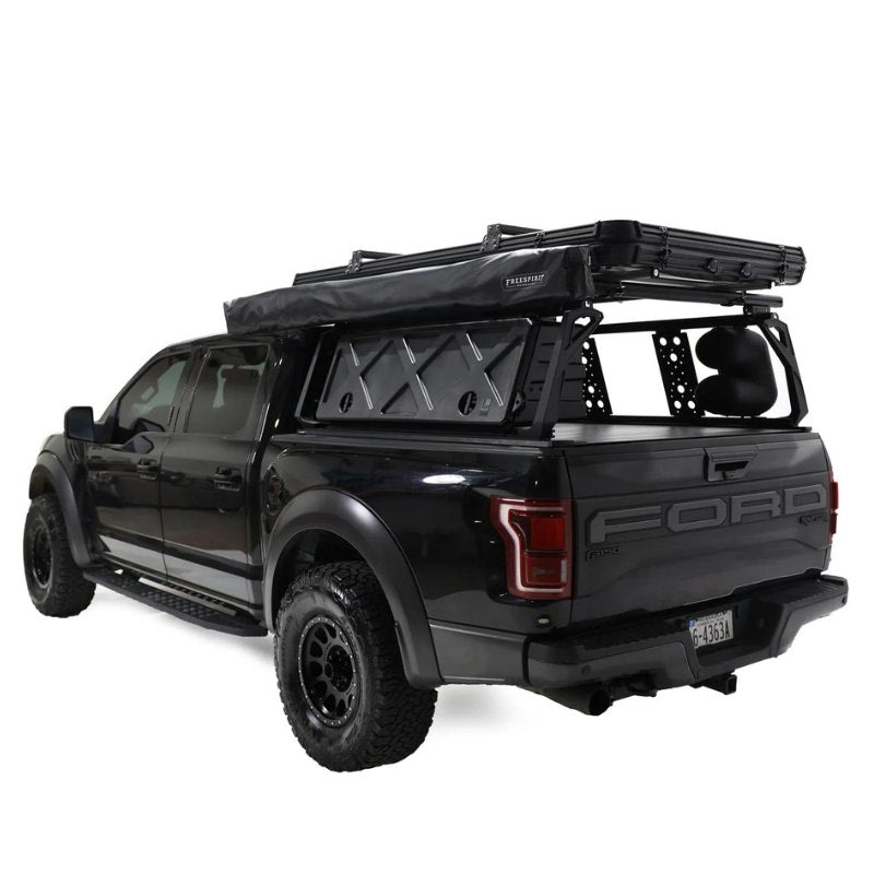 freespirit-recreation-270-awning-driver-side-closed-rear-corner-view-on-ford-f150-with-roof-rack-system-on-white-backround