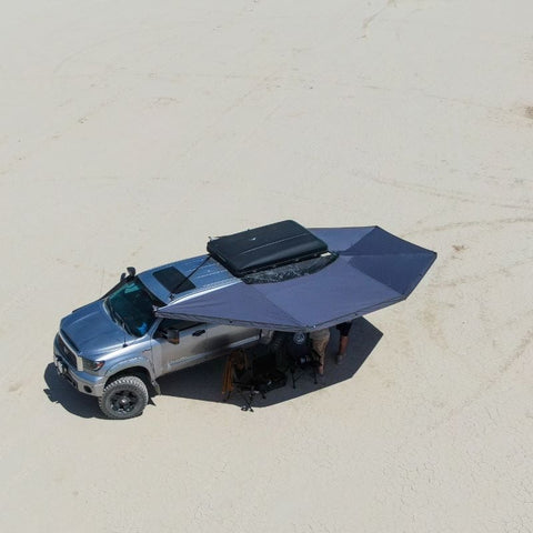 overland-vehicle-systems-awning-270-drone-view-on-toyota-tundra-with-people-camping-on-the-beach