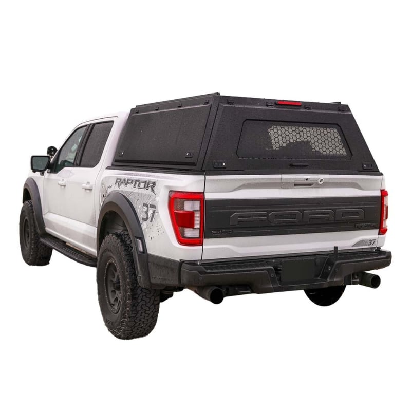 overland-vehicle-systems-expedition-truck-cap-for-ford-f150-black-closed-rear-corner-view-on-neutral-background