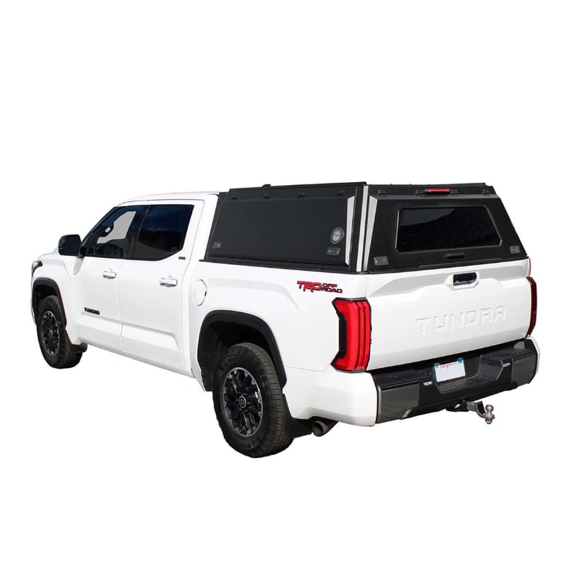 overland-vehicle-systems-expedition-truck-cap-for-toyota-tundra-black-closed-rear-corner-view-on-neutral-background