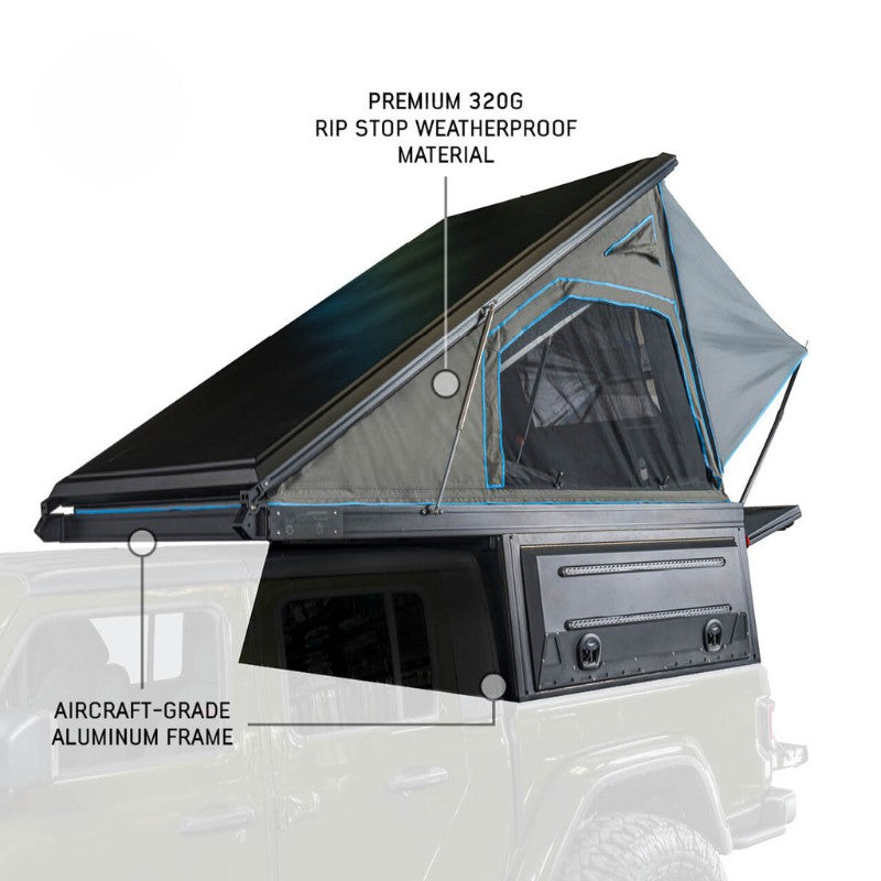 overland-vehicle-systems-magpak-camper-shell-roof-top-tent-for-toyota-tundra-open-front-corner-view-on-white-background