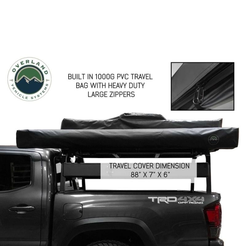 overland-vehicle-systems-nomadic-270-awning-driverside-closed-side-view-with-travel-cover-description-and-dimensions-on-toyota-tacoma-with-bed-rack