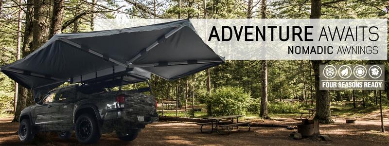 overland-vehicle-systems-nomadic-270-awning-driverside-open-rear-corner-view-on-toyota-tacoma-in-nature