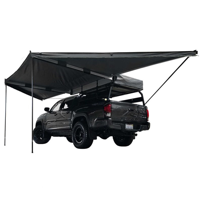 overland-vehicle-systems-nomadic-awning-180-driver-side-open-rear-corner-view-on-toyota-tacoma-with-poles-deployed