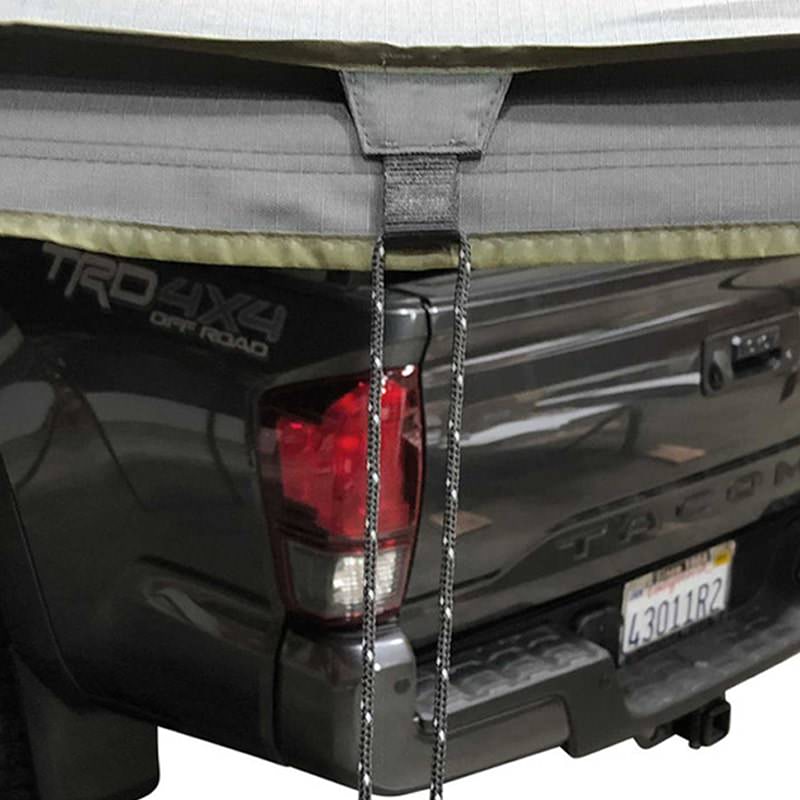 overland-vehicle-systems-nomadic-awning-180-with-zip-in-wall-open-rear-corner-view-on-toyota-tacoma-showing-tie-downs