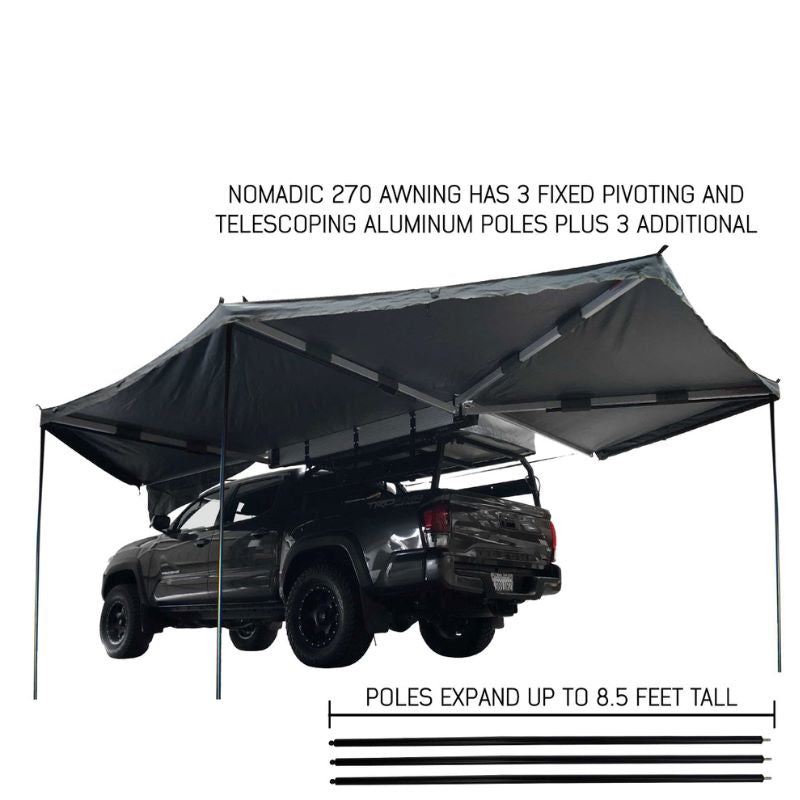 overland-vehicle-systems-nomadic-awning-270-driver-side-gray-open-rear-corner-view-on-toyota-tacoma-with-fixed-poles