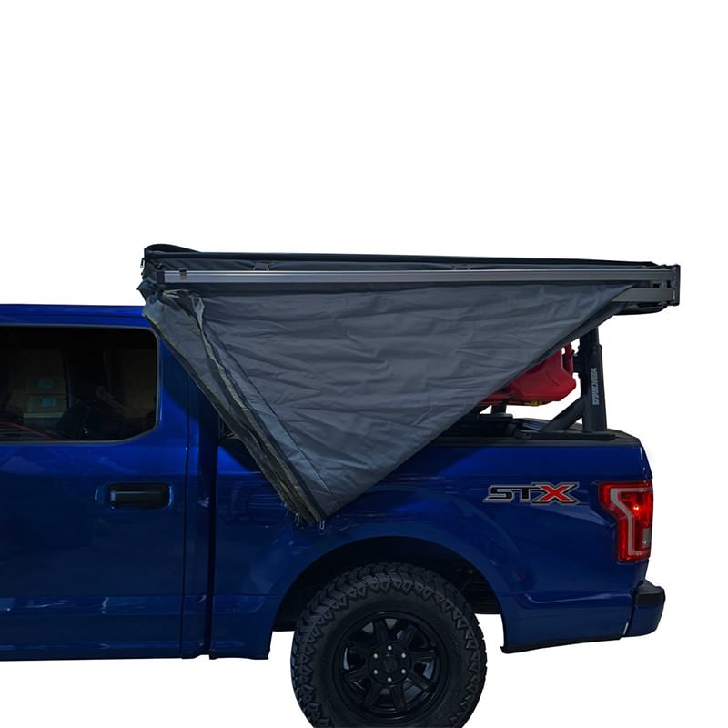 overland-vehicle-systems-nomadic-awning-270-lt-driver-side-semi-open-and-folded-on-ford-ranger-on-white-background