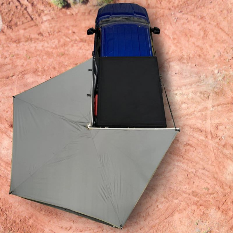 overland-vehicle-systems-nomadic-lt-270-awning-with-walls-driver-side-open-top-view-on-ford-ranger-in-desert