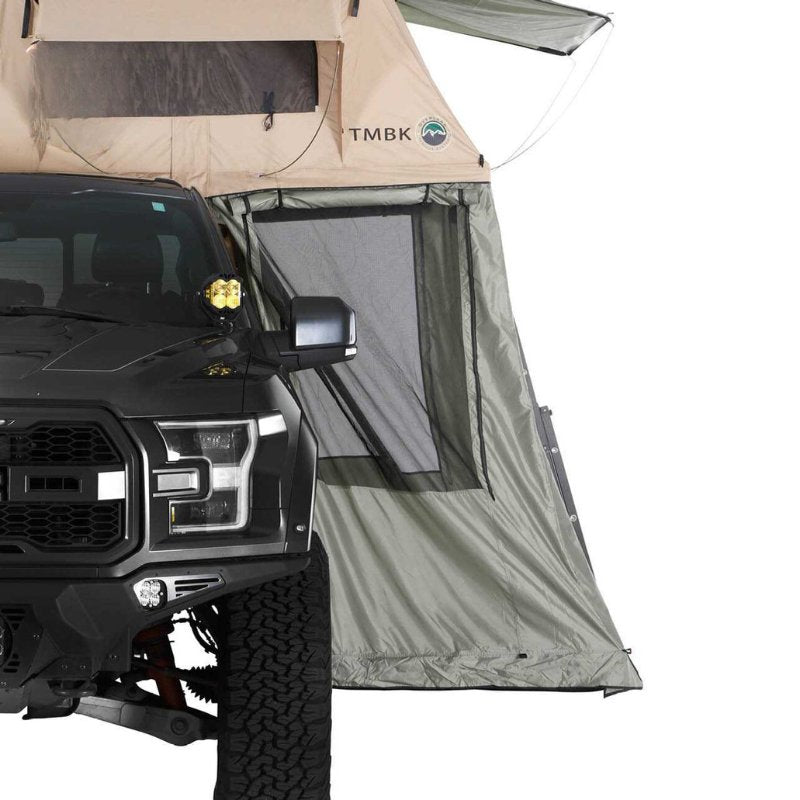 overland-vehicle-systems-tmbk-roof-top-tent-annex-green-base-black-floor-open-side-view-on-ford-on-white-background