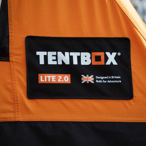 tentbox-lite-2-0-soft-shell-roof-top-tent-sunset-orange-open-side-view-with-tentbox-logo-on-fabric