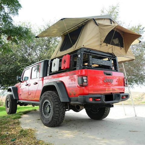 zroadz-overland-bed-rack-with-three-lifting-side-gates-for-jeep-gladiator-rear-corner-view-of-vehicle-with-rooftop-tent-in-nature