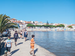 Family walking along the Sao Martinho do Porto lagoon