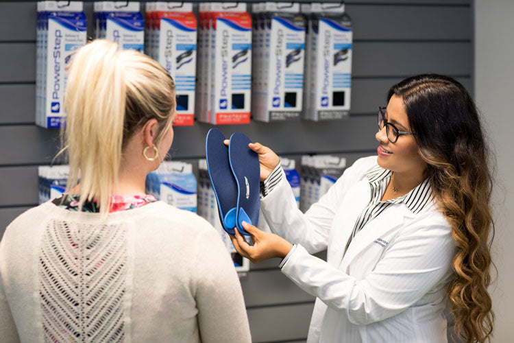 Doctor treating patient with ProTech Orthotic Insoles