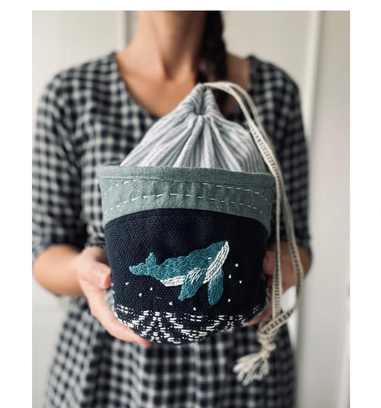 embroidered whale on fabric pouch