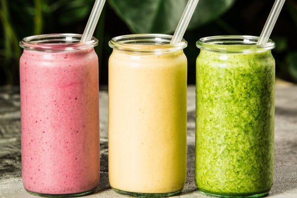 An image of three glasses of different smoothies