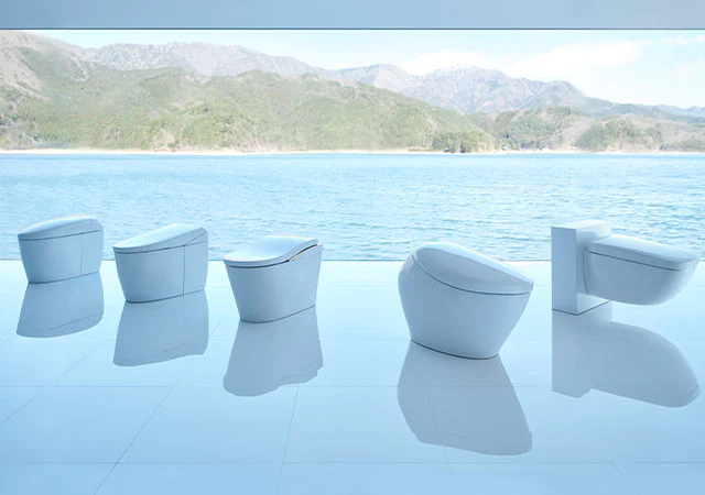 toto neorest toilets lined up by water