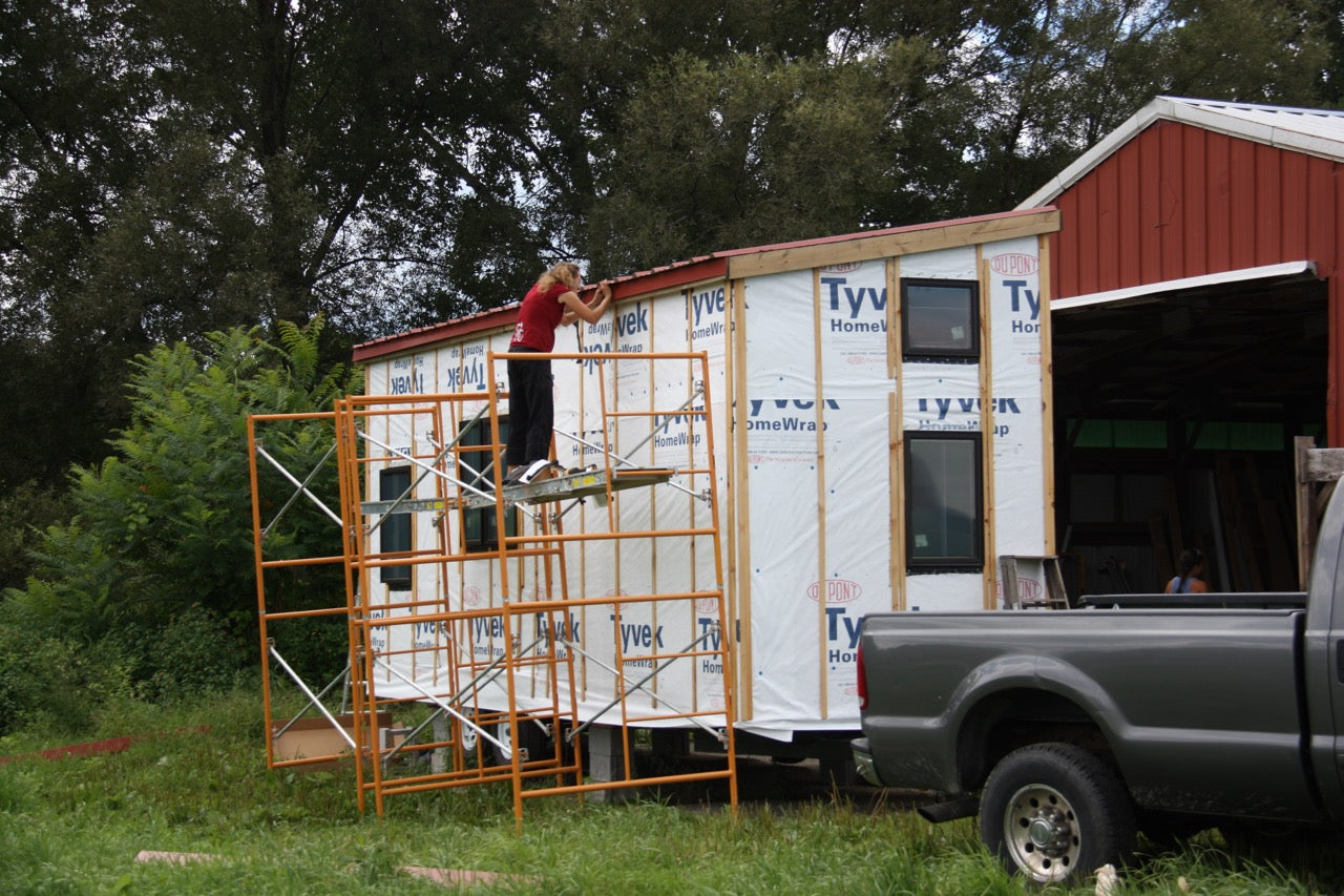 Exterior of tiny house showing WRB and rain screen furring strips